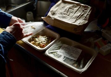 Barbara Teed unpacks a Meals on Wheels deliver for herself and her adult son Ryan, who has Down syndrome, on Wednesday, Jan. 29, 2025, in Bloomington, Minn. (AP photo/Mark Vancleave)