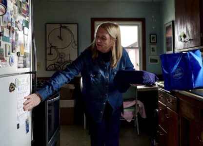 Barbara Teed unpacks a Meals on Wheels deliver for herself and her adult son Ryan, who has Down syndrome, on Wednesday, Jan. 29, 2025, in Bloomington, Minn. (AP photo/Mark Vancleave)