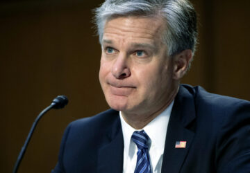 FILE - FBI Director Christopher Wray testifies during a Senate Judiciary hearing about the Inspector General's report on the FBI's handling of the Larry Nassar investigation on Capitol Hill, Wednesday, Sept. 15, 2021, in Washington. (Saul Loeb/Pool via AP, File)