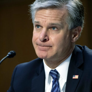 FILE - FBI Director Christopher Wray testifies during a Senate Judiciary hearing about the Inspector General's report on the FBI's handling of the Larry Nassar investigation on Capitol Hill, Wednesday, Sept. 15, 2021, in Washington. (Saul Loeb/Pool via AP, File)