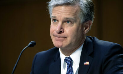 FILE - FBI Director Christopher Wray testifies during a Senate Judiciary hearing about the Inspector General's report on the FBI's handling of the Larry Nassar investigation on Capitol Hill, Wednesday, Sept. 15, 2021, in Washington. (Saul Loeb/Pool via AP, File)