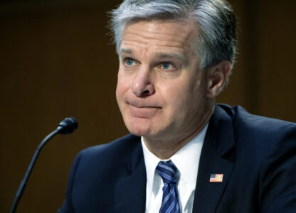 FILE - FBI Director Christopher Wray testifies during a Senate Judiciary hearing about the Inspector General's report on the FBI's handling of the Larry Nassar investigation on Capitol Hill, Wednesday, Sept. 15, 2021, in Washington. (Saul Loeb/Pool via AP, File)