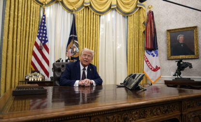 FILE - President Donald Trump answers questions from reporters as he signs an executive orders in the Oval Office of the White House, Jan. 23, 2025, in Washington. (AP Photo/Ben Curtis, File)