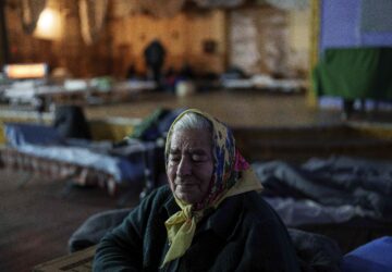 Kateryna Odraha, 83, cries after evacuation from the frontline village Andiivka, Donetsk region at a center for displaced people in Pavlohrad, Ukraine, Saturday, Feb. 1, 2024. (AP Photo/Evgeniy Maloletka)