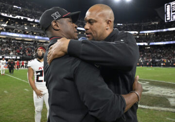 FILE - Las Vegas Raiders head coach Antonio Pierce, right, greets Atlanta Falcons head coach Raheem Morris, left, after an NFL football game Dec. 16, 2024, in Las Vegas. (AP Photo/David Becker, File)