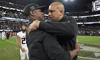 FILE - Las Vegas Raiders head coach Antonio Pierce, right, greets Atlanta Falcons head coach Raheem Morris, left, after an NFL football game Dec. 16, 2024, in Las Vegas. (AP Photo/David Becker, File)