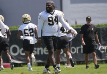 FILE - New Orleans Saints defensive end Cameron Jordan (94) walks on the field during an NFL OTA football practice in Metairie, La., June 5, 2024. (AP Photo/Gerald Herbert, File)