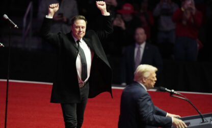 FILE - Elon Musk reacts as President-elect Donald Trump speaks at a rally ahead of the 60th Presidential Inauguration, Jan. 19, 2025, in Washington. (AP Photo/Alex Brandon, File)