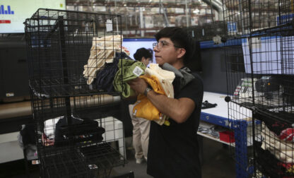 An employee works at a textile factory that produces T-shirts, in Ciudad Juarez, Mexico, Tuesday, Feb. 4, 2025. (AP Photo/Christian Chavez)