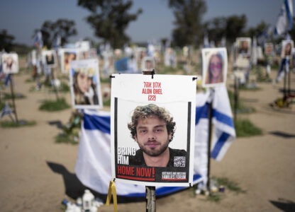 FILE - A poster depicting Israeli hostage Alon Ohel is displayed in Re'im, southern Israel at the Gaza border, Feb. 26, 2024, at a memorial site for the Nova music festival site where he was kidnapped to Gaza by Hamas on Oct. 7, 2023. (AP Photo/Maya Alleruzzo, File)