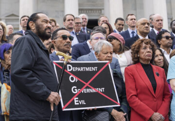 From left, Rep. Al Green, D-Texas, Rep. Kweisi Mfume, D-Md., Rep. Bonnie Watson Coleman, D-N.J., and Rep. Maxine Waters, D-Calif., join others as House Minority Leader Hakeem Jeffries, D-N.Y., speaks out against the Republican budget plan, on the House steps at the Capitol in Washington, Tuesday, Feb. 25, 2025. (AP Photo/J. Scott Applewhite)