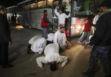 Freed Palestinian prisoners react as they arrive in the Gaza Strip after being released from an Israeli prison following a ceasefire agreement between Hamas and Israel in Khan Younis, Gaza Strip, Thursday, Feb. 27, 2025. (AP Photo/Jehad Alshrafi)