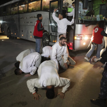 Freed Palestinian prisoners react as they arrive in the Gaza Strip after being released from an Israeli prison following a ceasefire agreement between Hamas and Israel in Khan Younis, Gaza Strip, Thursday, Feb. 27, 2025. (AP Photo/Jehad Alshrafi)