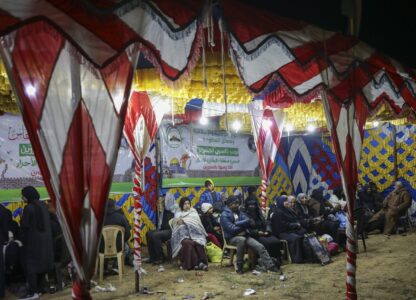 Relatives and friends of Palestinian prisoners to be released from Israeli prison wait for their arrival in Khan Younis, southern Gaza Strip, late Wednesday Feb. 26, 2025. (AP Photo/Jehad Alshrafi)