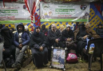 Relatives and friends of Palestinian prisoners to be released from Israeli prison wait for their arrival in Khan Younis, southern Gaza Strip, late Wednesday, Feb. 26, 2025. (AP Photo/Jehad Alshrafi)