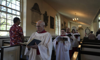 FILE - Choir members sing hymns at Christ Church in Philadelphia during Sunday service, Oct. 6, 2024. (AP Photo/Luis Andres Henao, File)