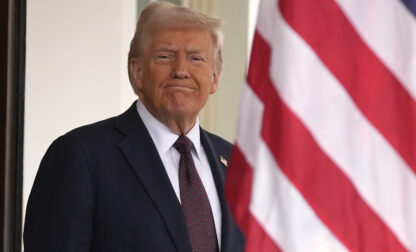 President Donald Trump stands before British Prime Minister Keir Starmer arrives at the White House, Thursday, Feb. 27, 2025, in Washington. (AP Photo/Evan Vucci)