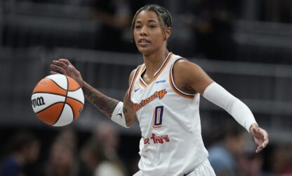 FILE - Phoenix Mercury's Natasha Cloud dribbles during the first half of a WNBA basketball game against the Indiana Fever in Indianapolis, on Friday, Aug. 16, 2024. (AP Photo/Darron Cummings, File)