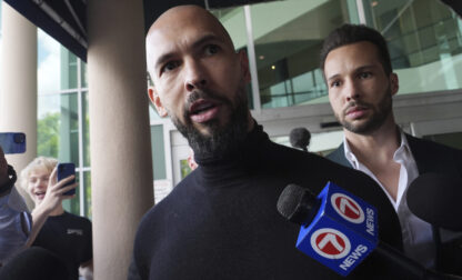 Influencer brothers Andrew and Tristan Tate arrive, Thursday, Feb. 27, 2025, in Fort Lauderdale, Fla. The brothers were charged with human trafficking in Romania and arrived in the U.S. after authorities lifted travel restrictions. (AP Photo/Marta Lavandier)