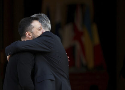 Britain's Prime Minister Keir Starmer, right, welcomes Ukrainian President Volodymyr Zelenskyy to the European leaders' summit to discuss Ukraine, at Lancaster House, London, Sunday March 2, 2025. (Toby Melville/Pool via AP)