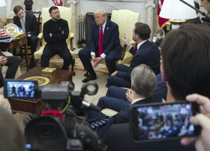 Vice President JD Vance, right, speaks with Ukrainian President Volodymyr Zelenskyy, left, as President Donald Trump, center, listens in the Oval Office at the White House, Friday, Feb. 28, 2025, in Washington. (AP Photo/ Mystyslav Chernov)