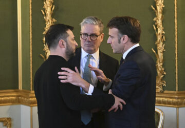 Britain's Prime Minister Keir Starmer, center, Ukraine's President Volodymyr Zelenskyy, left, and France's President Emmanuel Macron meet during the European leaders' summit to discuss Ukraine, hosted by Britain's Prime Minister Keir Starmer, at Lancaster House, London, Sunday March 2, 2025. (Justin Tallis/Pool via AP)