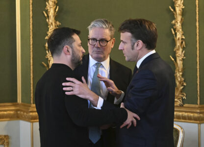 Britain's Prime Minister Keir Starmer, center, Ukraine's President Volodymyr Zelenskyy, left, and France's President Emmanuel Macron meet during the European leaders' summit to discuss Ukraine, hosted by Britain's Prime Minister Keir Starmer, at Lancaster House, London, Sunday March 2, 2025. (Justin Tallis/Pool via AP)