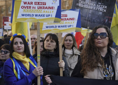 Ukrainian supporters demonstrate outside Downing Street with flags and placards as Britain's Prime Minister Keir Starmer holds a Ukraine Summit at Lancaster House in London, Sunday, March 2, 2025.(AP Photo/Alberto Pezzali)