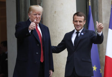 FILE - French President Emmanuel Macron, right, and U.S President Donald Trump thumb up at the Elysee Palace in Paris, Saturday, Nov.10, 2018. (AP Photo/Thibault Camus, File)