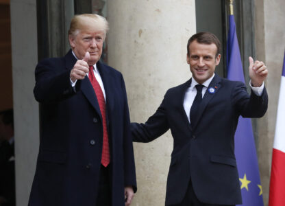 FILE - French President Emmanuel Macron, right, and U.S President Donald Trump thumb up at the Elysee Palace in Paris, Saturday, Nov.10, 2018. (AP Photo/Thibault Camus, File)