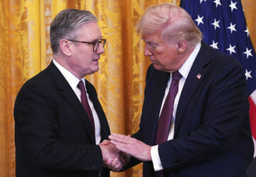 Britain's Prime Minister Keir Starmer, left, and U.S. President Donald Trump shake hands at a joint press conference in the East Room at the White House Thursday, Feb. 27, 2025, in Washington. (Carl Court/Pool Photo via AP)