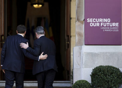 Britain's Prime Minister Keir Starmer, right, welcomes French President Emmanuel Macron to the European leaders' summit to discuss Ukraine, at Lancaster House, London, Sunday March 2, 2025. (Toby Melville/Pool via AP)