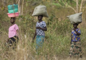 Women walk to the market near Nzara, South Sudan on Saturday, Feb. 15, 2025. (AP Photo/Brian Inganga)