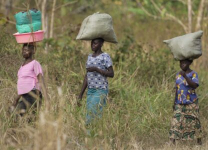 Women walk to the market near Nzara, South Sudan on Saturday, Feb. 15, 2025. (AP Photo/Brian Inganga)