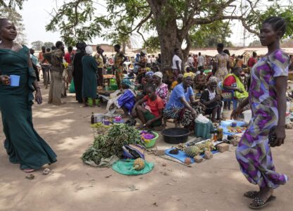 Women sell their goods at Nzara open market in Nzara, South Sudan on Saturday, Feb. 15, 2025. (AP Photo/Brian Inganga)