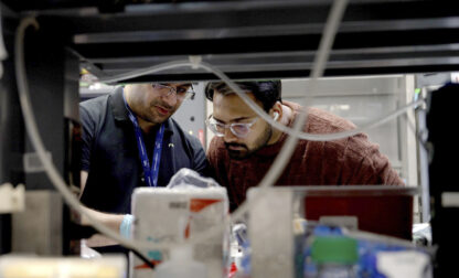 Lab workers at Johns Hopkins University work in Richard Huganir's lab in Baltimore, Md., on Feb. 26, 2025. (AP Photo/Shelby Lum)