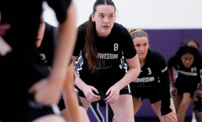 Northwestern freshman Kat Righeimer, one of six women from Kobe Bryant’s Mamba Academy going through their first experience with college basketball, warms up with teammates during NCAA college basketball practice in Evanston, Ill., Tuesday, Feb. 25, 2025. (AP Photo/Nam Y. Huh)