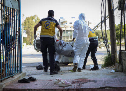 In this photo provided by the Syrian Civil Defense White Helmets, members of the Syrian White Helmets collect the bodies of people found dead following a recent wave of violence between Syrian security forces and gunmen loyal to former President Bashar Assad, as well as subsequent sectarian attacks, in the coastal city of Baniyas, Syria, Sunday, March 9, 2025. (Syrian Civil Defense White Helmets via AP)