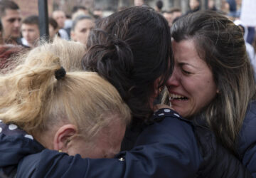 Women cry during a vigil for the victims of a massive nightclub fire in the town of Kocani, North Macedonia, Monday, March 17, 2025. (AP Photo/Visar Kryeziu)