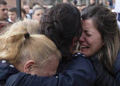 Women cry during a vigil for the victims of a massive nightclub fire in the town of Kocani, North Macedonia, Monday, March 17, 2025. (AP Photo/Visar Kryeziu)