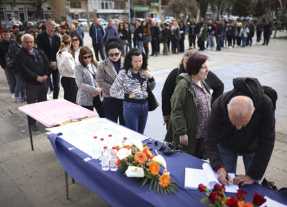 People wait in line to write condolence messages for the victims of a massive nightclub fire in the town of Kocani, North Macedonia, Monday, March 17, 2025, (AP Photo/Armin Durgut)