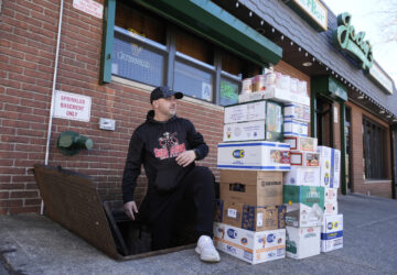 Terence Haggerty loads supplies into the basement of his bar, Jody's Club Forest, in Staten Island, New York, Monday, March 10, 2025. (AP Photo/Seth Wenig)