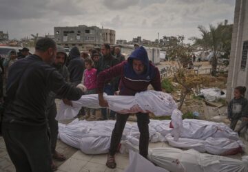 The bodies of victims of an Israeli army airstrike are prepared for burial at Indonesia Hospital in Beit Lahia, northern Gaza Strip, Thursday, March 20, 2025. (AP Photo/Jehad Alshrafi)