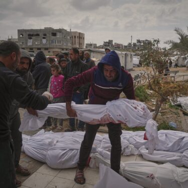 The bodies of victims of an Israeli army airstrike are prepared for burial at Indonesia Hospital in Beit Lahia, northern Gaza Strip, Thursday, March 20, 2025. (AP Photo/Jehad Alshrafi)