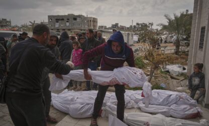 The bodies of victims of an Israeli army airstrike are prepared for burial at Indonesia Hospital in Beit Lahia, northern Gaza Strip, Thursday, March 20, 2025. (AP Photo/Jehad Alshrafi)