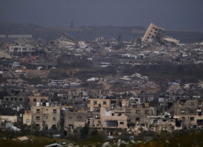 Buildings destroyed during the Israeli air and ground offensive in the Gaza Strip as seen from southern Israel, Thursday, March 20, 2025. (AP Photo/Leo Correa)