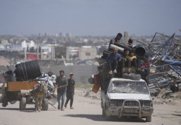 Displaced Palestinians, carrying their belongings traveling from Beit Hanoun to Jabaliya, a day after Israel's renewed offensive in the Gaza Strip, Wednesday, March 19, 2025. (AP Photo/Jehad Alshrafi)